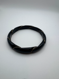 Vintage Unmarked Black Twisted Bangle Bracelet with Gold Tone Accents, 3"