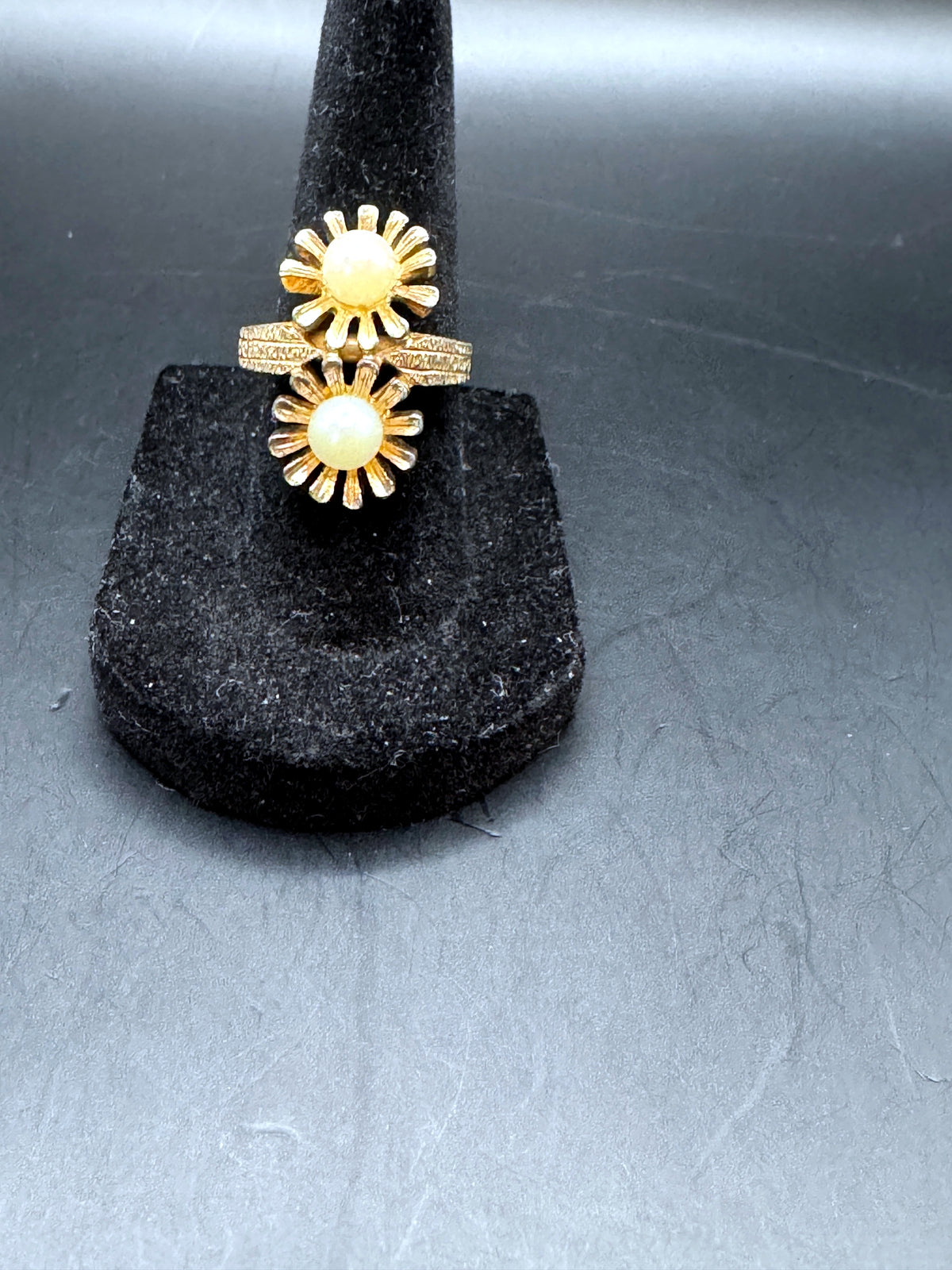 Unbranded gold-tone adjustable double-flower ring, front view