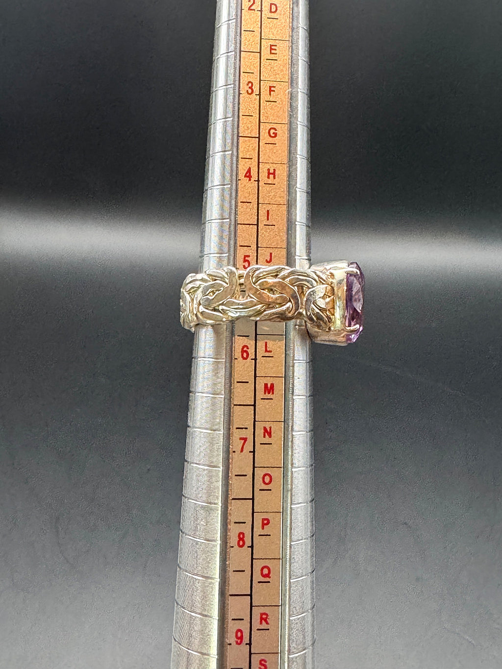 Silver tone ring size 5.5 shown on ring mandrel
