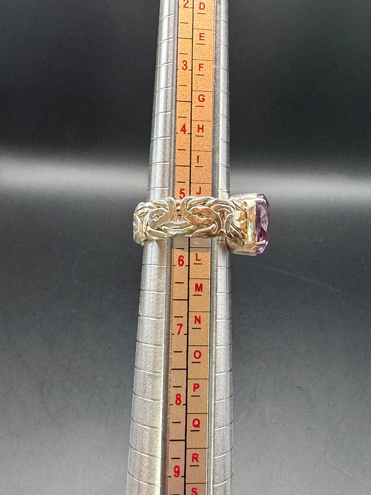 Silver tone ring size 5.5 shown on ring mandrel